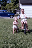 http://leighlarson.com/JPG%20Final%20Leigh%20on%20Trike%20with%20Reed%20standing,%20August,%201943.jpg.jpg